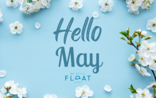 Text that says "Hello May" placed over a light blue background with white flowers around the border.